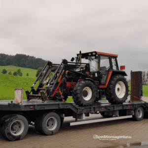 Traktor auf Tiefbett LKW